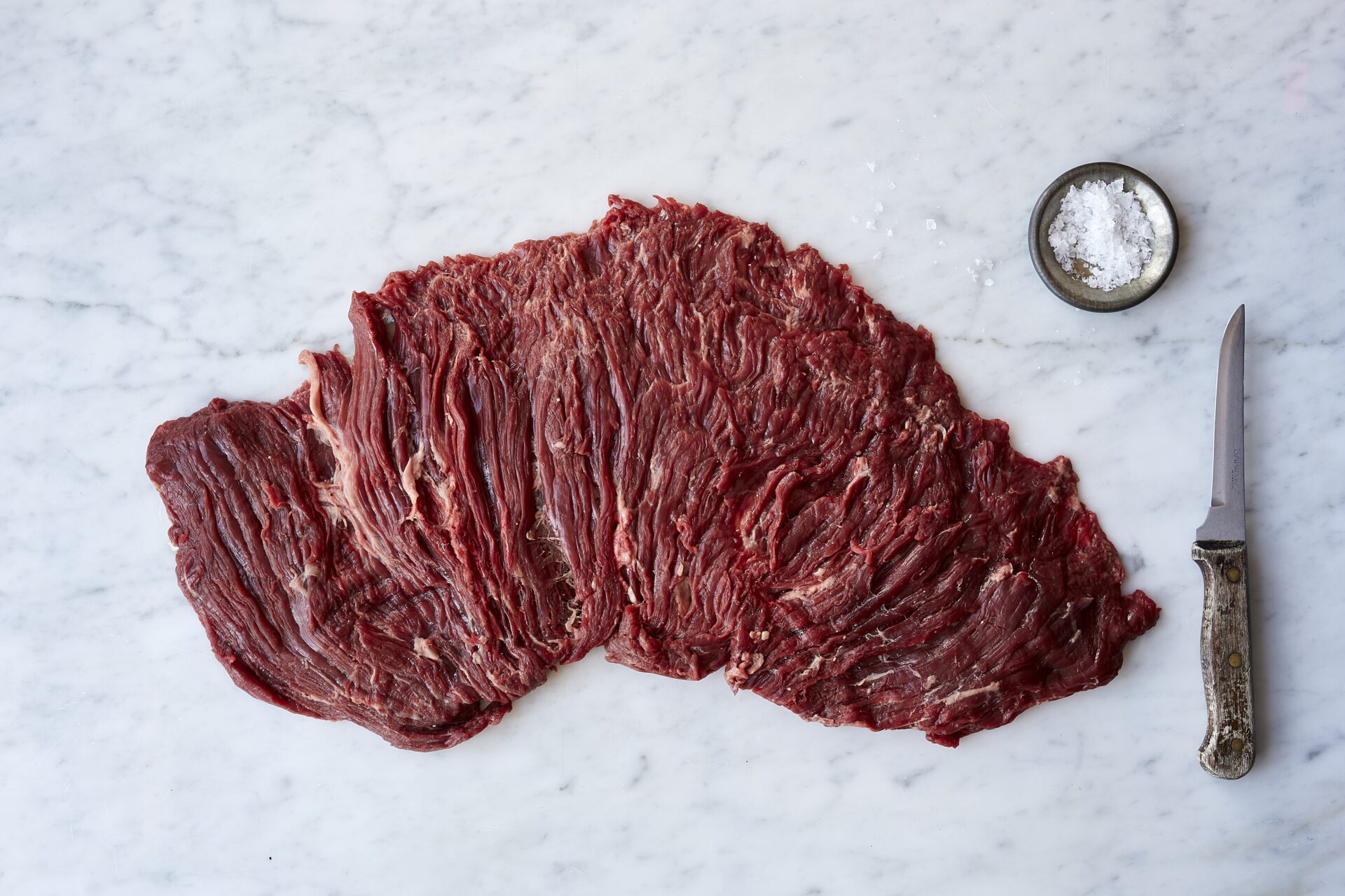 Bavette steak fanned out on a board